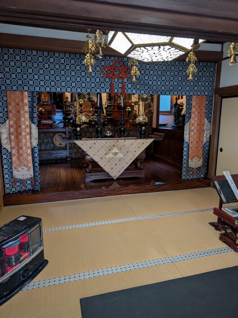 The inside of a temple with the Zelda triforce on the main altar