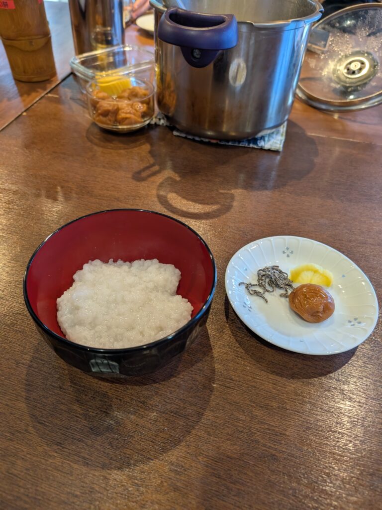 traditional monk breakfast with rice porride, pickled plum, pickled radish and salted kemp